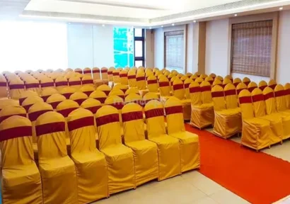A banquet hall featuring suitable seating arrangements is a venue for meetings and celebrations.
